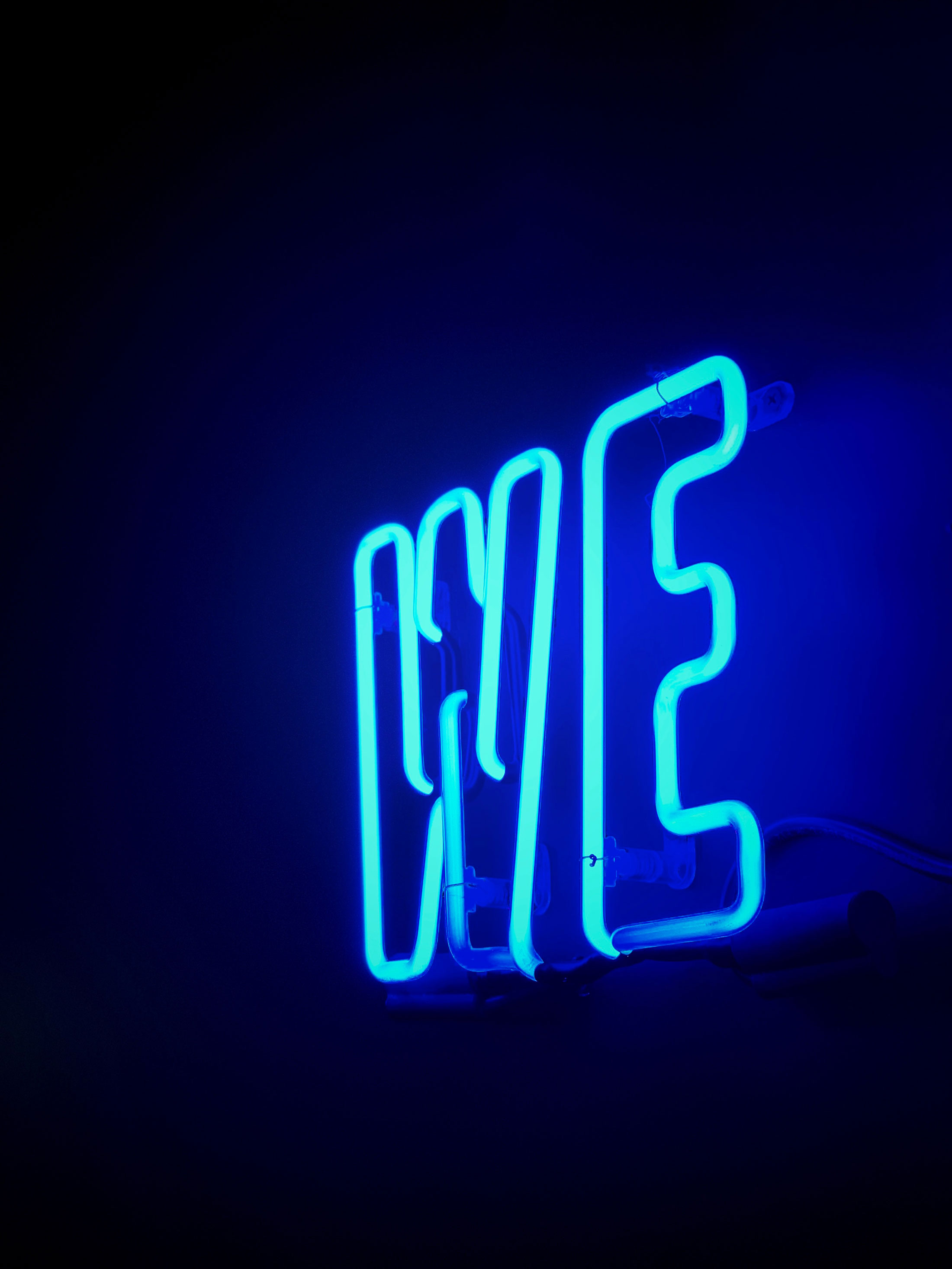 Neon sign saying "we."